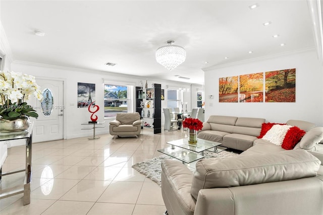 living room with visible vents, crown molding, light tile patterned floors, baseboards, and a chandelier