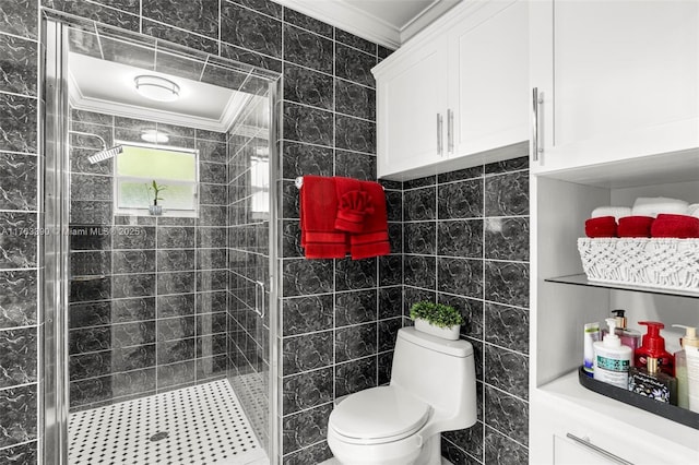 full bath featuring tile walls, crown molding, and a shower stall