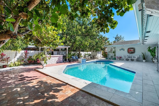 view of pool with a patio area, a fenced in pool, and a fenced backyard