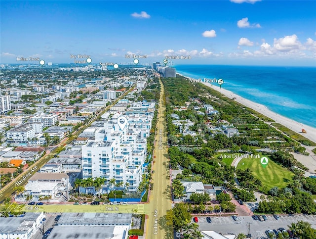 drone / aerial view with a view of the beach, a view of city, and a water view