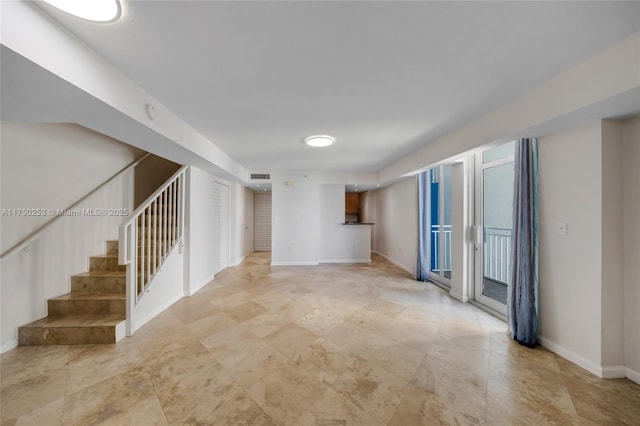 interior space featuring visible vents, stairs, and baseboards