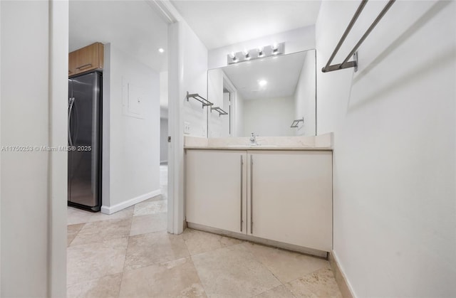 bathroom featuring vanity and baseboards