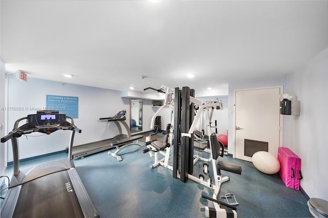 exercise room featuring visible vents and baseboards