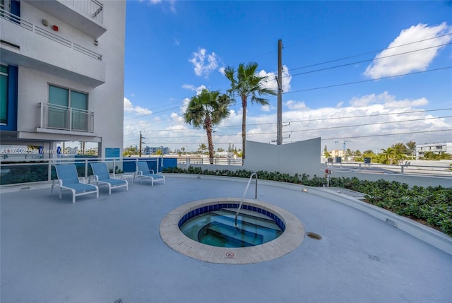 view of pool featuring a hot tub