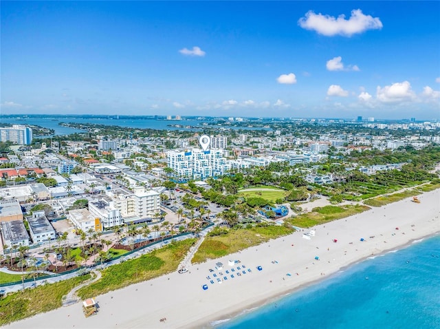 aerial view featuring a view of city, a water view, and a view of the beach