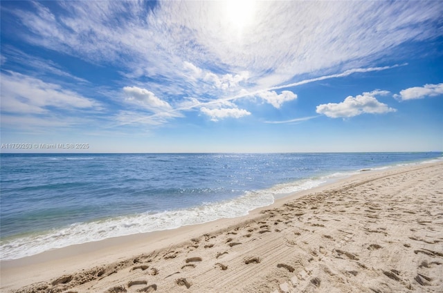 view of water feature with a beach view