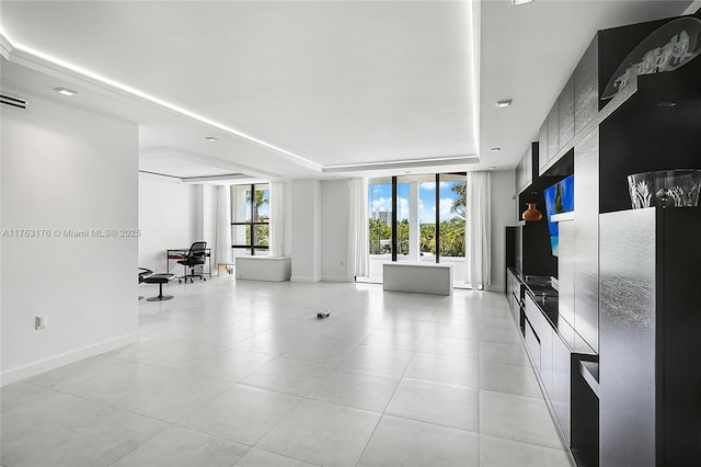 9801 Collins Ave Unit 5M, Bal Harbour, FL 33154 - living room featuring a tray ceiling and light tile patterned floors