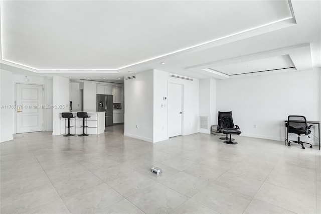 9801 Collins Ave Unit 5M, Bal Harbour, FL 33154 - unfurnished living room with a tray ceiling, light tile patterned floors, and recessed lighting