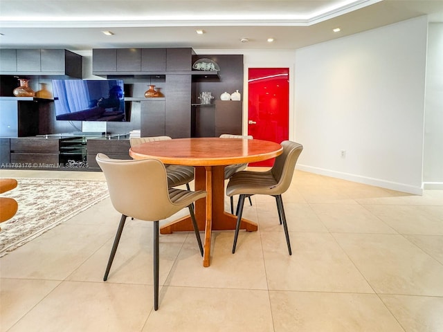 dining room with light tile patterned floors, recessed lighting, and baseboards