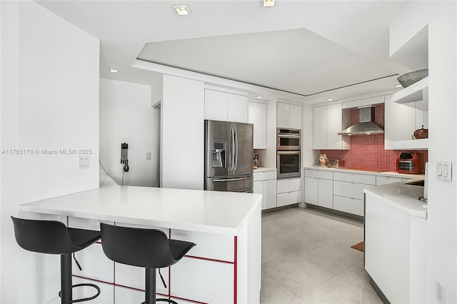 9801 Collins Ave Unit 5M, Bal Harbour, FL 33154 - kitchen with stainless steel appliances, a peninsula, modern cabinets, open shelves, and wall chimney range hood