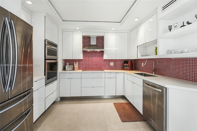 9801 Collins Ave Unit 5M, Bal Harbour, FL 33154 - kitchen with appliances with stainless steel finishes, modern cabinets, open shelves, wall chimney exhaust hood, and white cabinetry