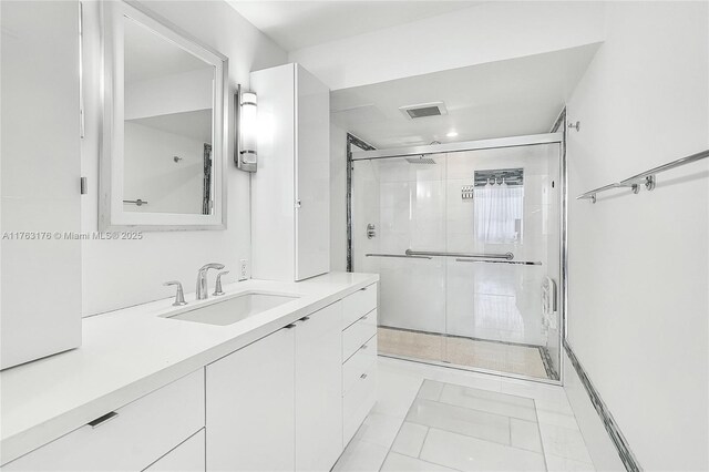 9801 Collins Ave Unit 5M, Bal Harbour, FL 33154 - full bathroom with vanity and a shower stall