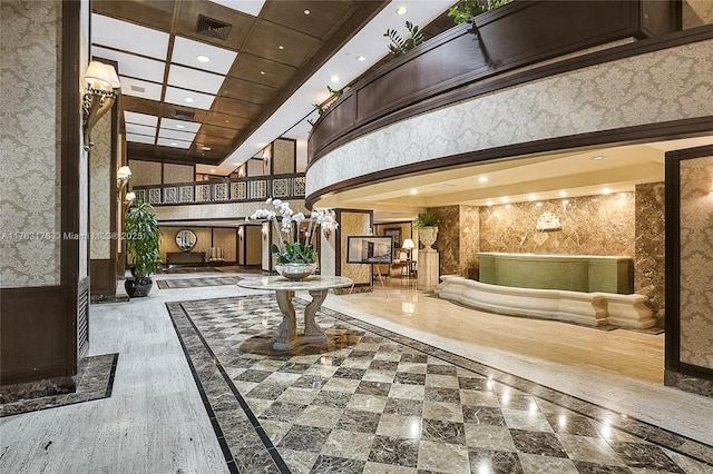 9801 Collins Ave Unit 5M, Bal Harbour, FL 33154 - common area with a high ceiling, wallpapered walls, and recessed lighting
