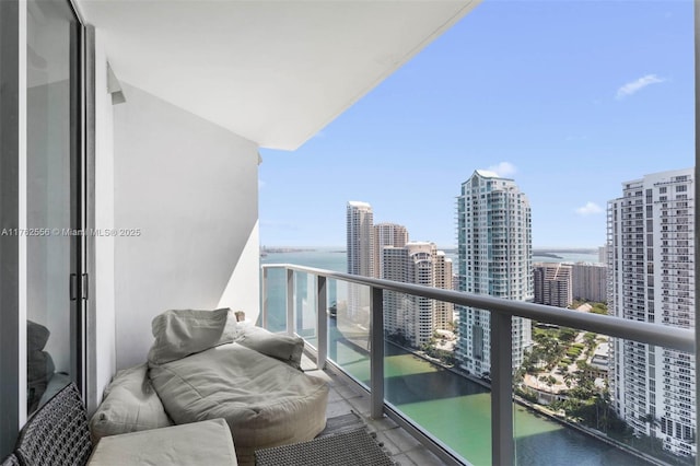 balcony with a water view and a city view