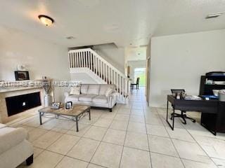 tiled living room with stairway