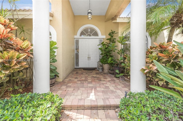 doorway to property with stucco siding