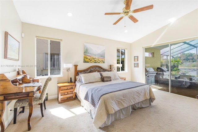 bedroom featuring multiple windows, light colored carpet, lofted ceiling, and access to exterior