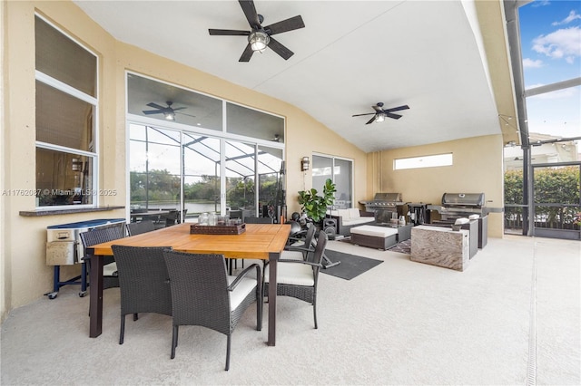 sunroom / solarium featuring ceiling fan and vaulted ceiling