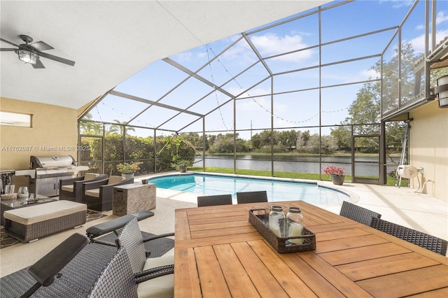 outdoor pool featuring outdoor dining space, a patio, area for grilling, a water view, and a lanai