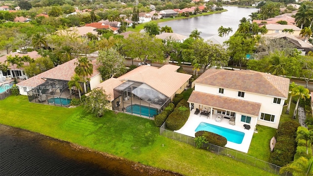 drone / aerial view with a residential view and a water view