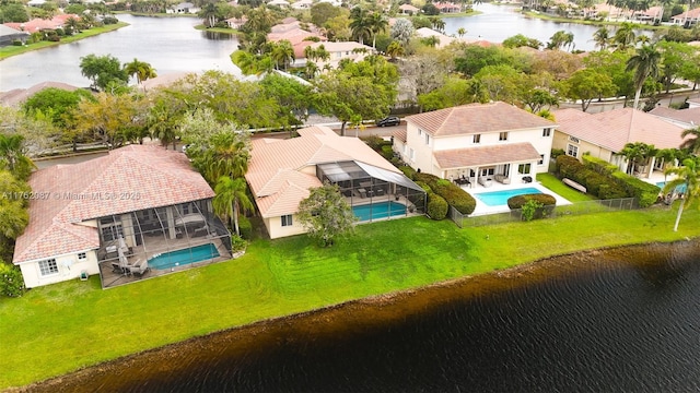 birds eye view of property with a residential view and a water view