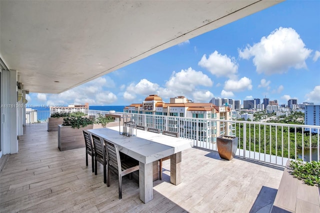 view of patio / terrace with a balcony and a city view