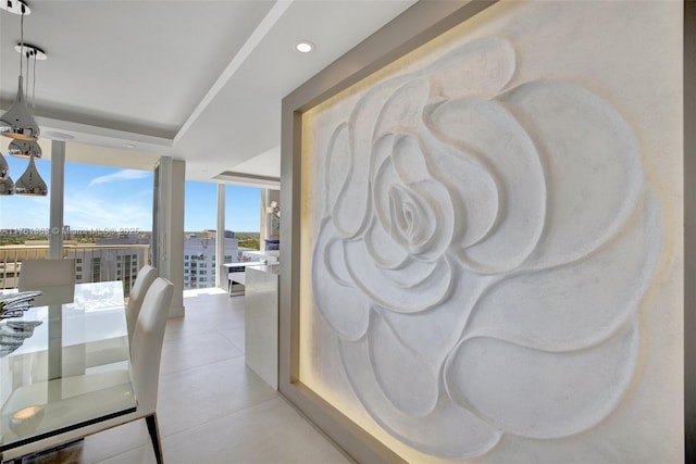 dining room with recessed lighting, a view of city, and a wall of windows