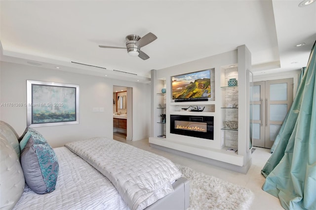 bedroom featuring a glass covered fireplace, recessed lighting, and ceiling fan