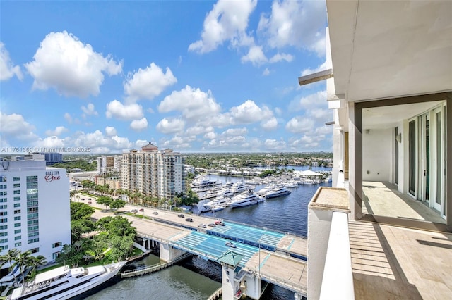 exterior space with a water view and a city view