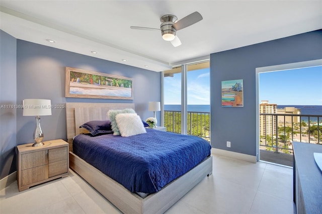 bedroom with baseboards, a water view, tile patterned flooring, and access to outside
