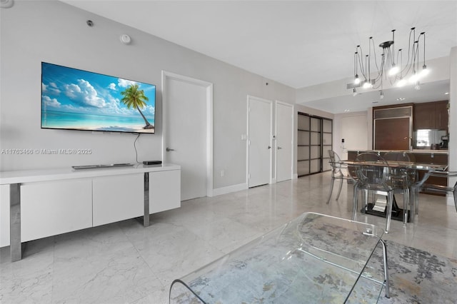 living room with baseboards and marble finish floor