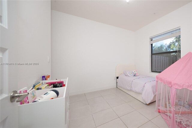 tiled bedroom with baseboards