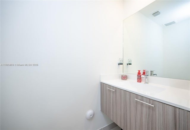 bathroom featuring visible vents and vanity