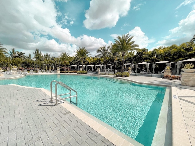 community pool featuring a gazebo and a patio area