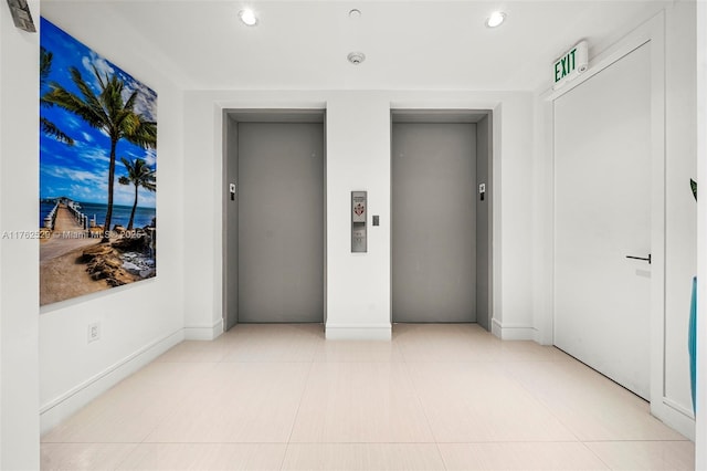 unfurnished bedroom featuring tile patterned flooring, elevator, recessed lighting, and baseboards