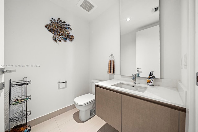 bathroom featuring tile patterned flooring, visible vents, toilet, and vanity