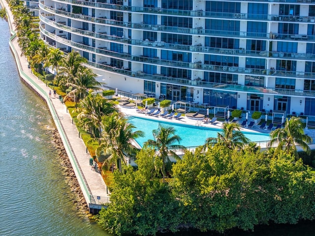 view of pool featuring a water view