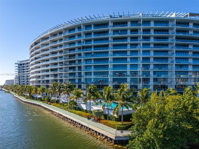 view of building exterior with a water view