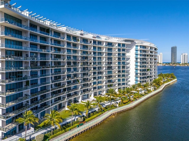 view of property featuring a city view and a water view