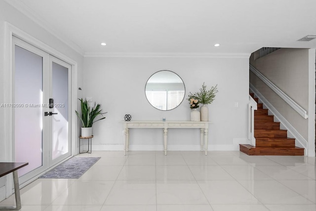 foyer with visible vents, ornamental molding, stairway, french doors, and baseboards