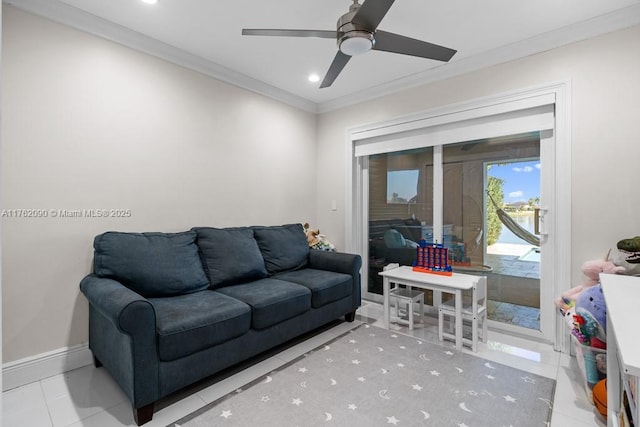 living area featuring crown molding, baseboards, recessed lighting, tile patterned floors, and a ceiling fan