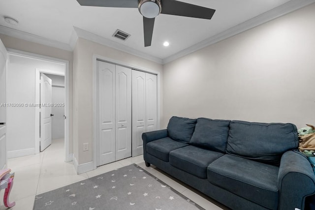 tiled living area with ceiling fan, visible vents, baseboards, and ornamental molding