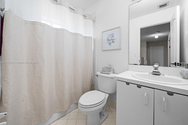 bathroom with visible vents, toilet, curtained shower, tile patterned flooring, and vanity