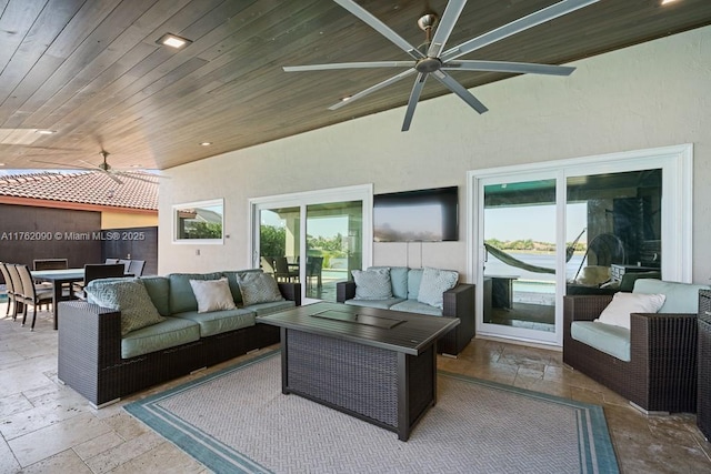 view of patio featuring outdoor dining space, an outdoor living space, and ceiling fan