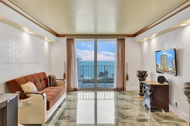 living room featuring baseboards, marble finish floor, and crown molding