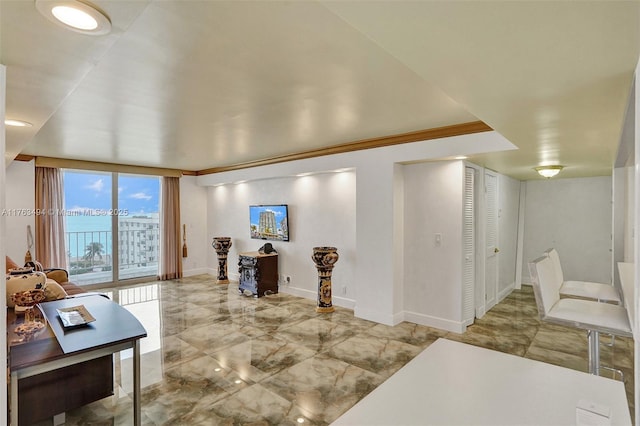 living room featuring marble finish floor and baseboards