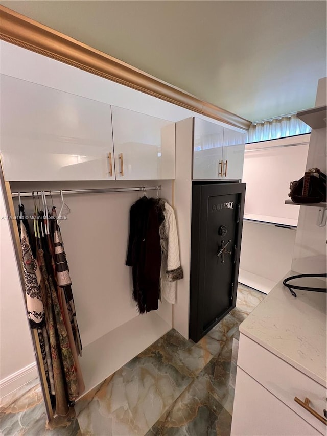 bathroom with marble finish floor