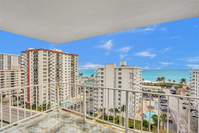 balcony with a city view and a water view