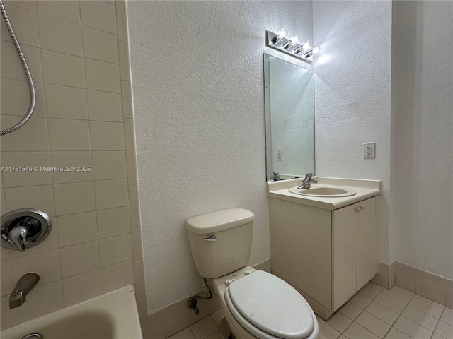 full bath featuring vanity, tile patterned floors, toilet, and shower / bathtub combination