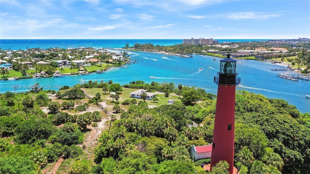 birds eye view of property with a water view